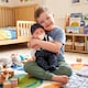 image 9 of BiBi Doll 20" Pebble Baby Doll Boy with Formal Bow Tie Outfit, Sounds & Dummy Toy