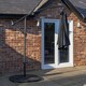 image 5 of Outdoor 4 Person Round Glass Top Garden Dining Table Chairs With Black Banana Parasol and Base