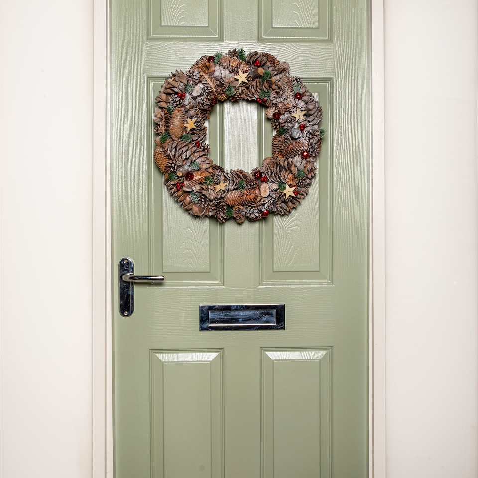 image 1 of 50cm Frosted Hanging Christmas Wreath with Red Jingle Bells & Wooden Stars