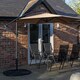 image 3 of Outdoor 4 Person Rectangular Glass Top Garden Dining Table Chairs With Beige Banana Parasol and Base
