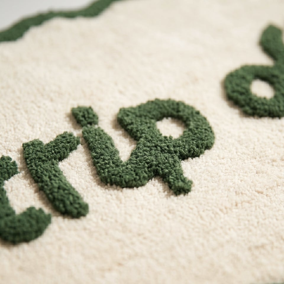image 1 of Strip Off Slogan Scalloped Bath Mat