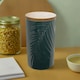 image 1 of Interiors By Premier Dark Green Large Storage Jar With Bamboo Lid,Jar With Embossed Tropical Leaf Design,Spice Storage Canister