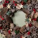 image 5 of 36cm Frosted Hanging Christmas Wreath with Red Jingle Bells & Wooden Stars