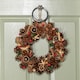 image 1 of 36cm Winter Spice Hanging Christmas Wreath with Pine Cones Red Berries & Dried Fruit
