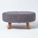 image 1 of Homescapes Sea Grey Large Round Cotton Knitted Footstool on Legs | Grey | 62 x 62 x 30 cm