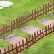 image 2 of Outsunny Pack of 12 Wooden Plant Border Fence Garden Fixed Picket Fence Brown