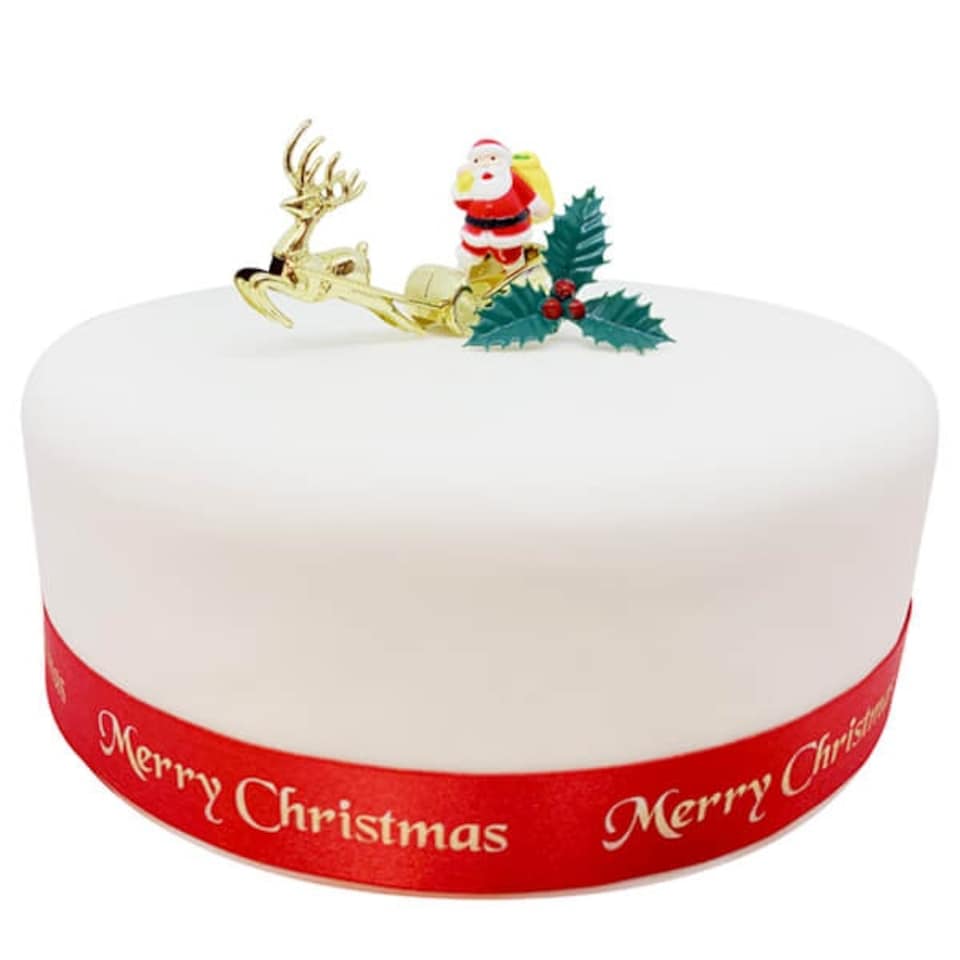 image 1 of Anniversary House Santa & Golden Sleigh Plastic Cake Topper & Holly Pick