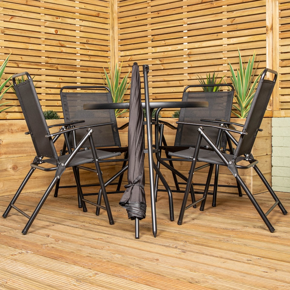 image 1 of Samuel Alexander Outdoor 4 Seater Round Glass Top Table and Chairs Patio Set with Parasol in Black