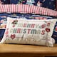 image 1 of Catherine Lansfield Merry Christmas Cross Stitch 30x50cm Cushion Natural Cream | Natural | 30 x 50 cm