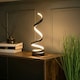 image 1 of ValueLights Infinity Black Single Twist Integrated LED Table Lamp