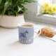 image 2 of KitchenCraft Fine Bone China Woodcut Horse 250ml Can Mug | Blue
