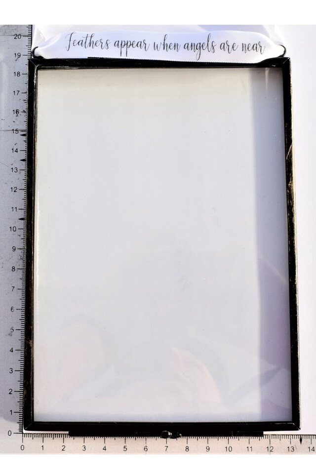 image 1 of In Memory of Baby. Baby Feet Real feather Floating Picture Frame