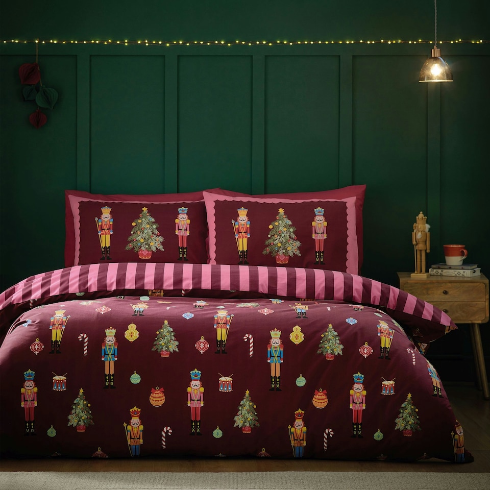 image 1 of Catherine Lansfield Christmas Nutcracker Stripe Reversible Duvet Cover Set Plum | Purple | Plum | Super King