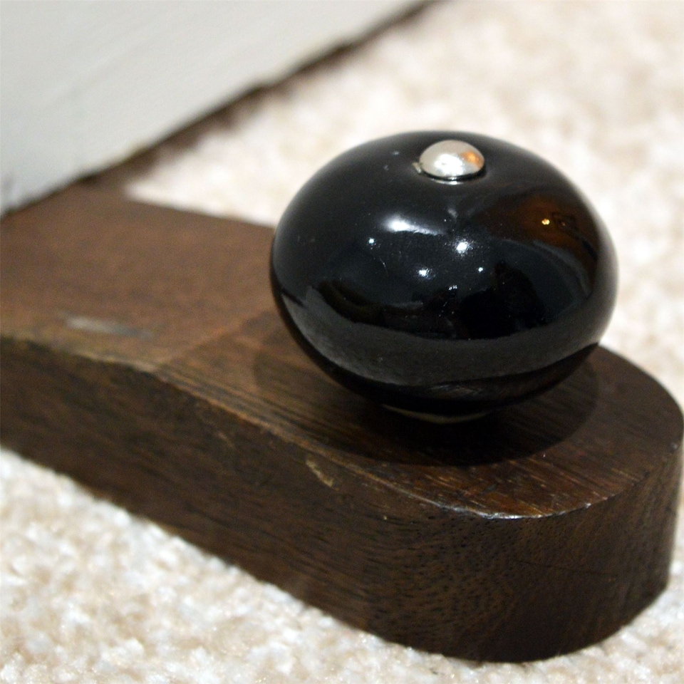 image 1 of Nicola Spring Wooden Door Stop - Black