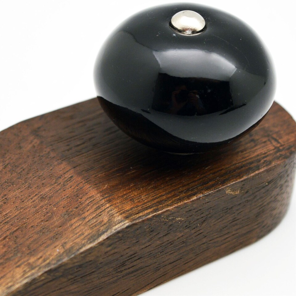 image 1 of Nicola Spring Wooden Door Stop - Black