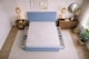 image 2 of Divan Bed Set Headboard and Footboard with Mattress 4ft Small Double Ice Blue Suede Storage 2 Drawers Left Side Laying in Bed
