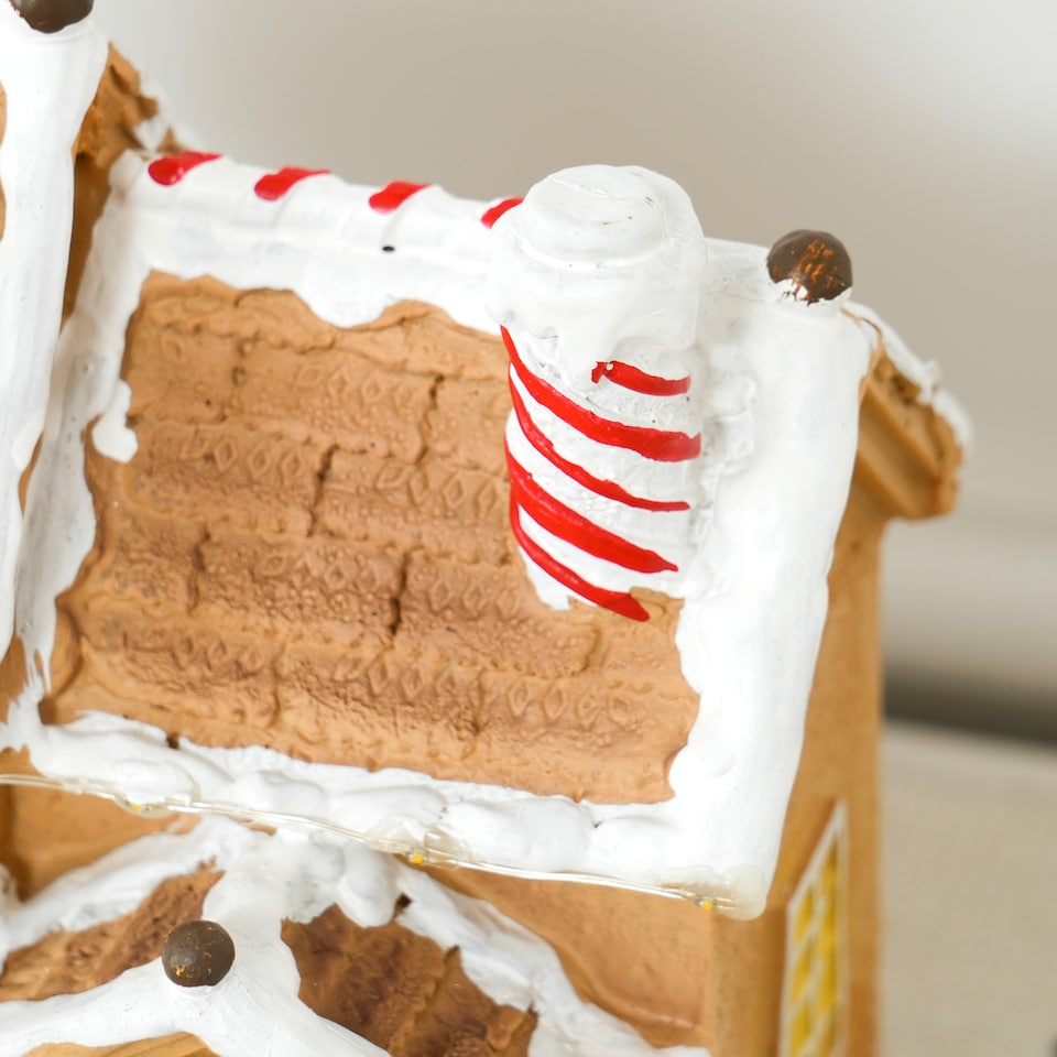 image 1 of HOMCOM Christmas Village Gingerbread House with LED Lights and Music, Lighted and Musical Christmas Candy House with Gingerbread Man, Battery Operated, Brown