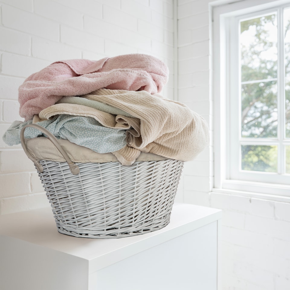 image 1 of Wickerfield Oval Wicker Laundry and Storage Basket with Handles and Removable Cotton Liner