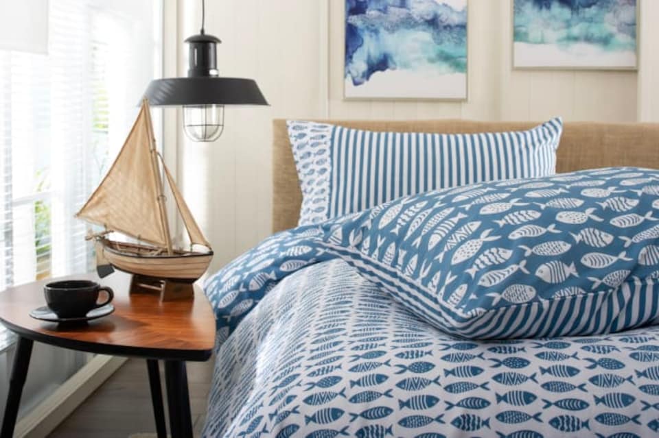 image 1 of Small Fish  Cotton Duvet Set with Stripe Reverse & Printed Fabric Bag | Multi | Super King