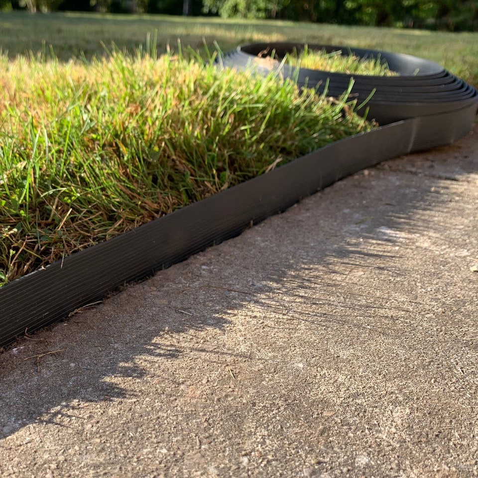 image 1 of Flexible Black Plastic Garden Lawn Edging with 40 Pegs (10m) - 4 Rolls