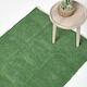 image 1 of Homescapes Dark Olive 100% Cotton Plain Chenille Rug with Natural Trim - 45 x 70 cm Green | 45 x 70 cm