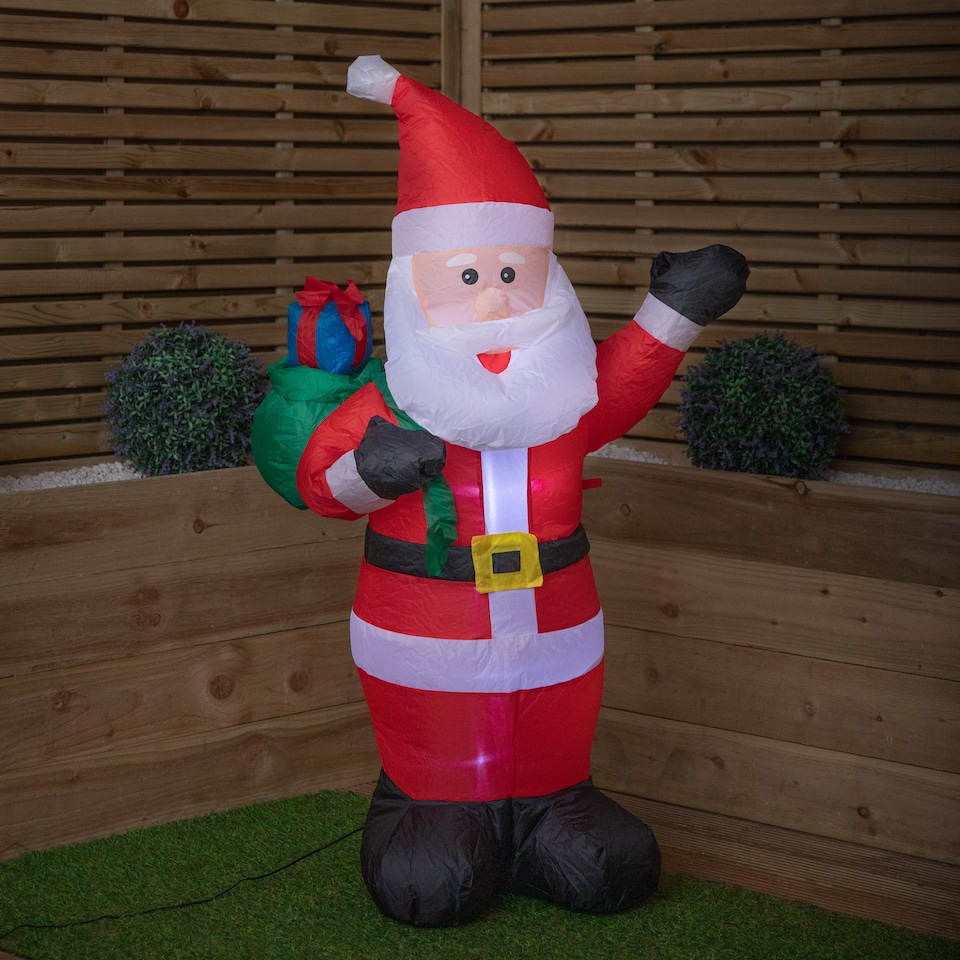 image 1 of 130cm (4ft) Inflatable LED Outdoor Christmas Standing Santa with Gift in Sack