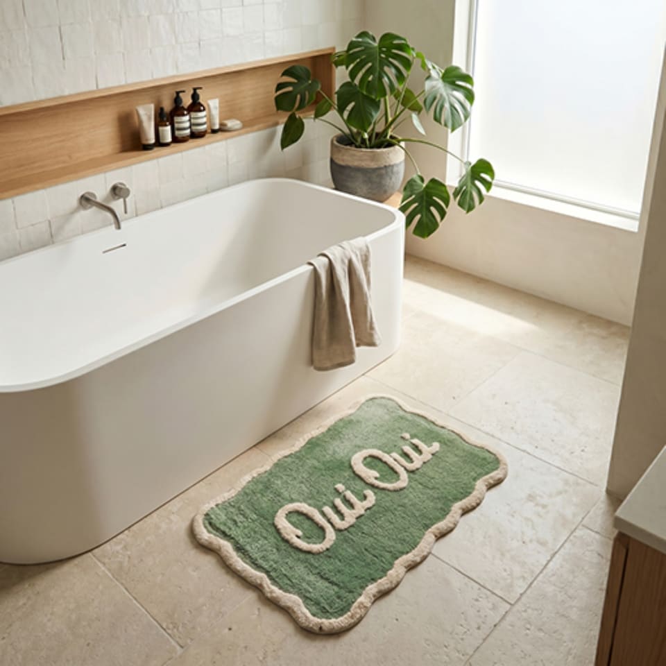 image 1 of Oui Oui Slogan Scalloped Bath Mat