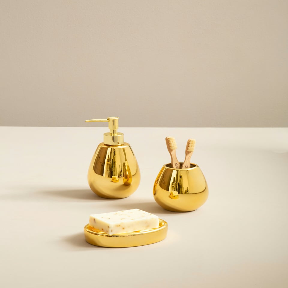 image 1 of Interiors by Premier Dolomite Gold 3 Piece Bathroom Set, Ceramic Bath Accessories Set, Lotion Dispenser, Tumbler, And Soap Dish