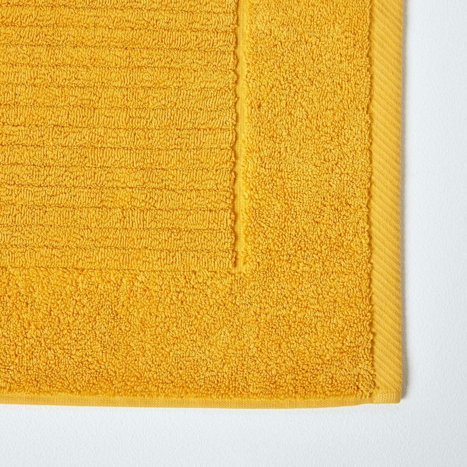 image 1 of Homescapes Imperial Plain Cotton Ochre Yellow Bath Mat Yellow