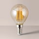image 2 of ValueLights 10 Pack Filament E14 Amber Tinted Golfball Light Bulbs | Clear