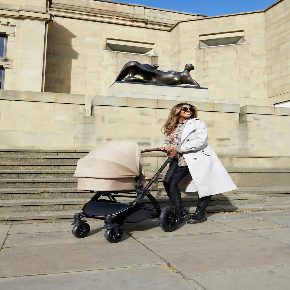 image 1 of Stomp Luxe 12pc Travel System with Stratus i-Size Car Seat & ISOFIX Base, Carrycot, Reversible Seat, Rain Cover & More (Black/Woodland/Tan)