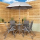 image 1 of Samuel Alexander Outdoor 4 Seater Round Glass Top Table and Chairs Patio Set with Parasol in Grey