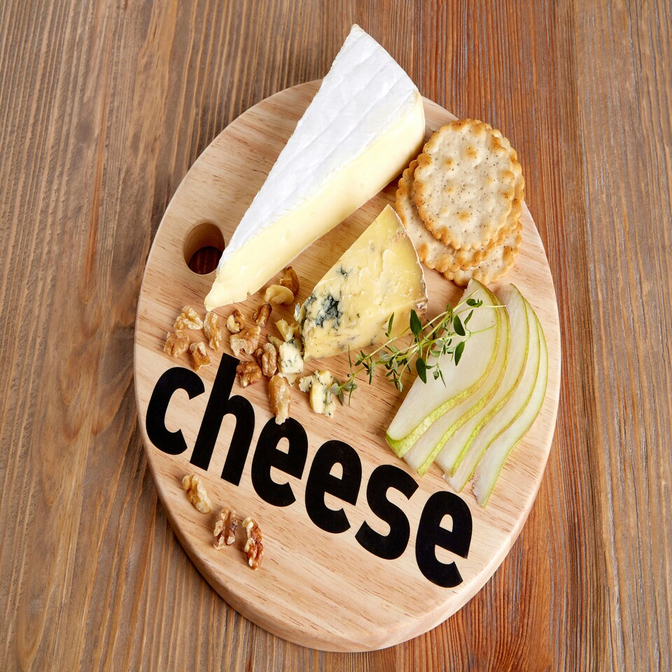 image 1 of Interiors By Premier Cheese Board, Durable 25cm Round Rubberwood Serving Board, Bold 'Cheese' Typography