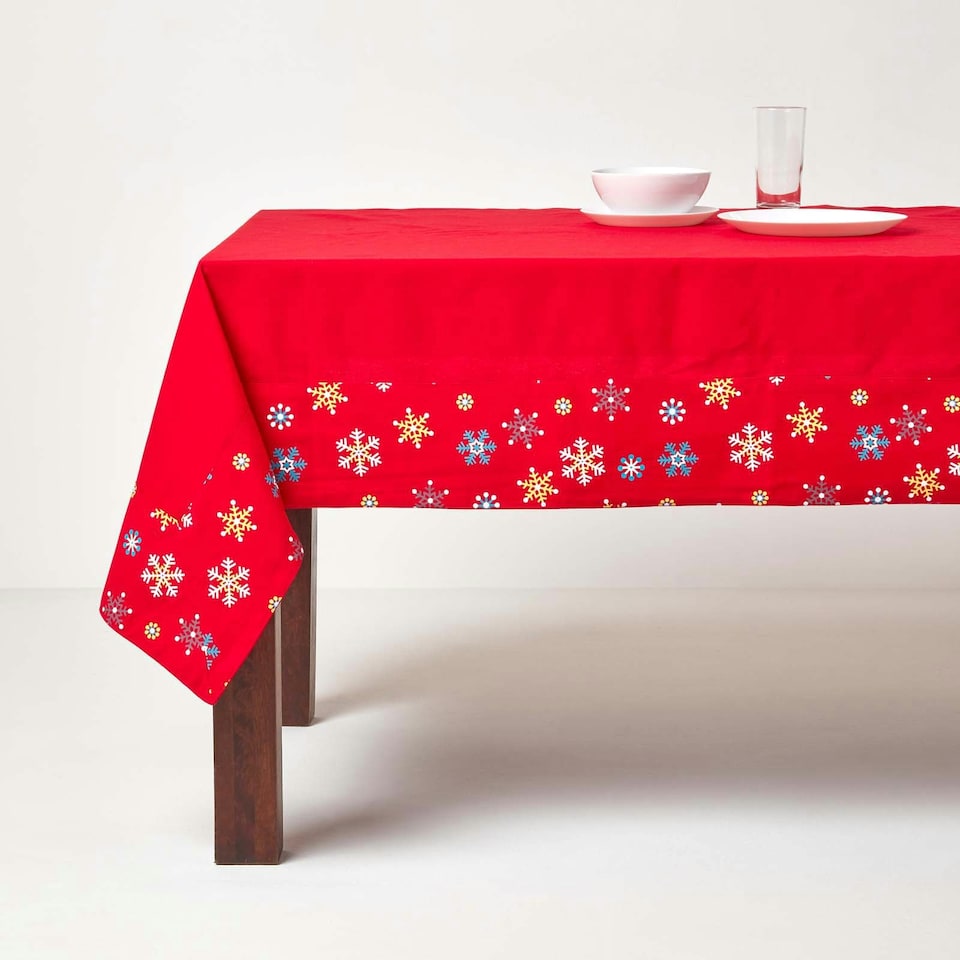 image 1 of Homescapes Cotton Christmas Red Snowflake Border Tablecloth - 137 x 178 cm | Red | 137cm x 178cm (54" x 70")