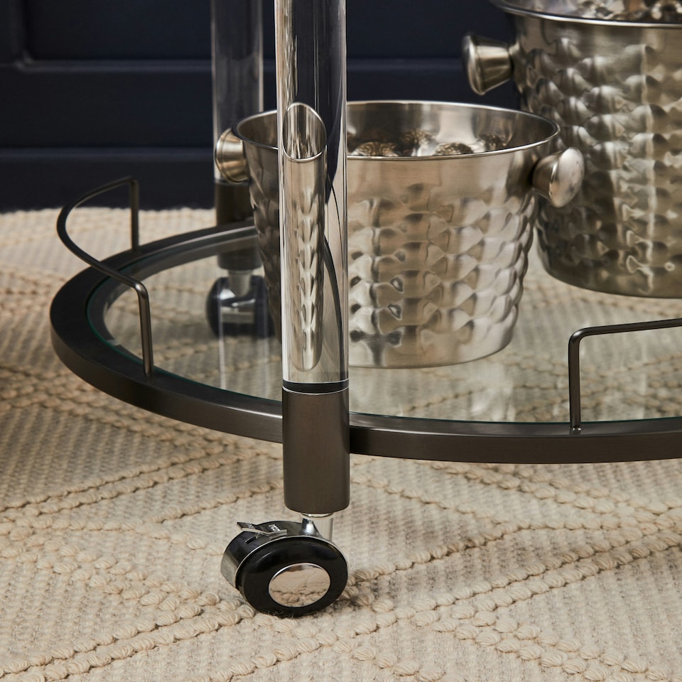 image 1 of Interiors by Premier Round Drinks Trolley, Two‑Tier Glass Shelves with Acrylic Supports, Mid‑Century Stainless Steel Bar Cart Black