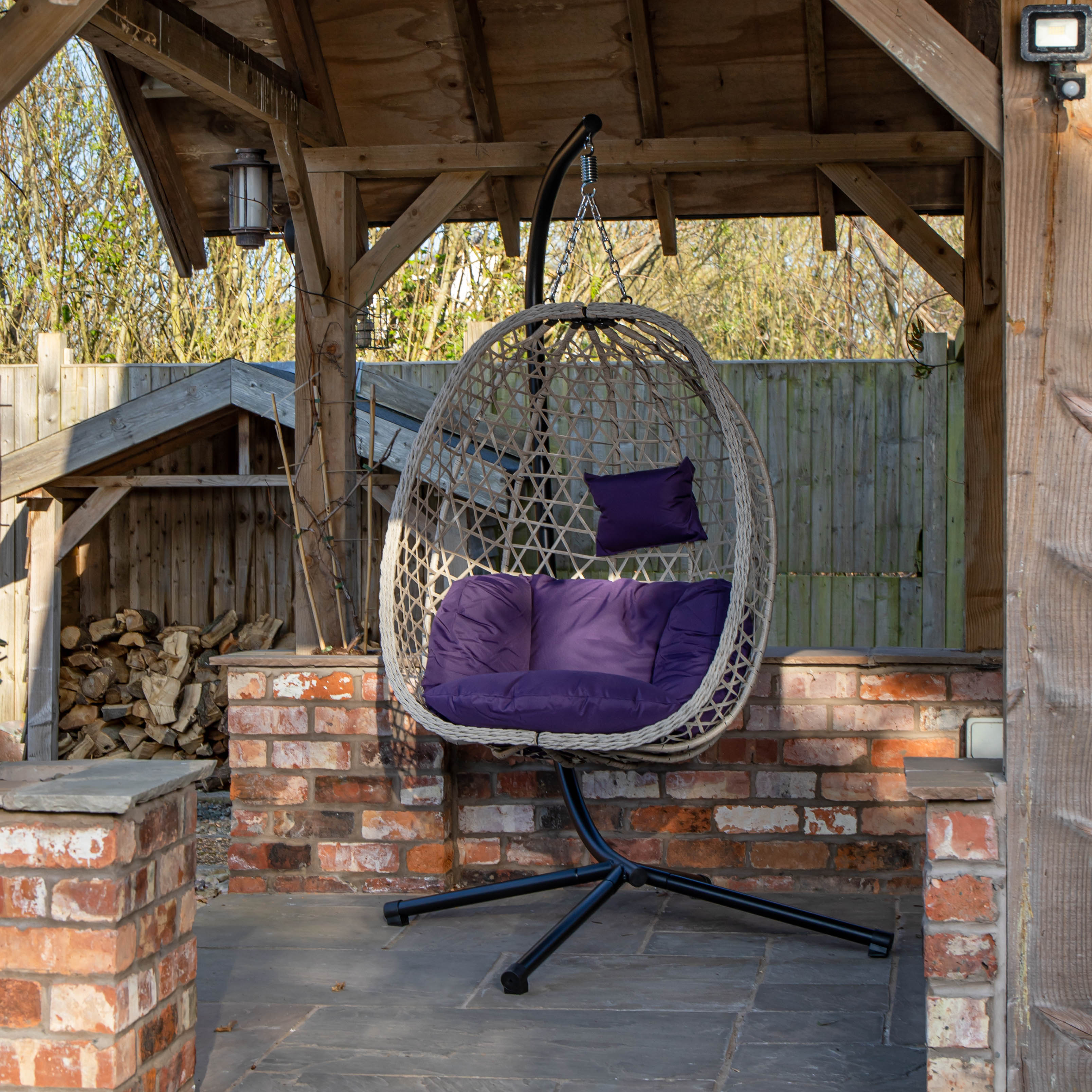 Samuel Alexander Hanging Garden Rattan Egg Chair with Steel Frame and Waterproof Cover in Indigo | Purple | Indigo