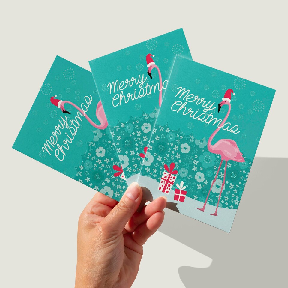image 1 of Flamingo in Santa Hat Christmas Cards Set of 8 - A6 Size - Floral Snowflakes