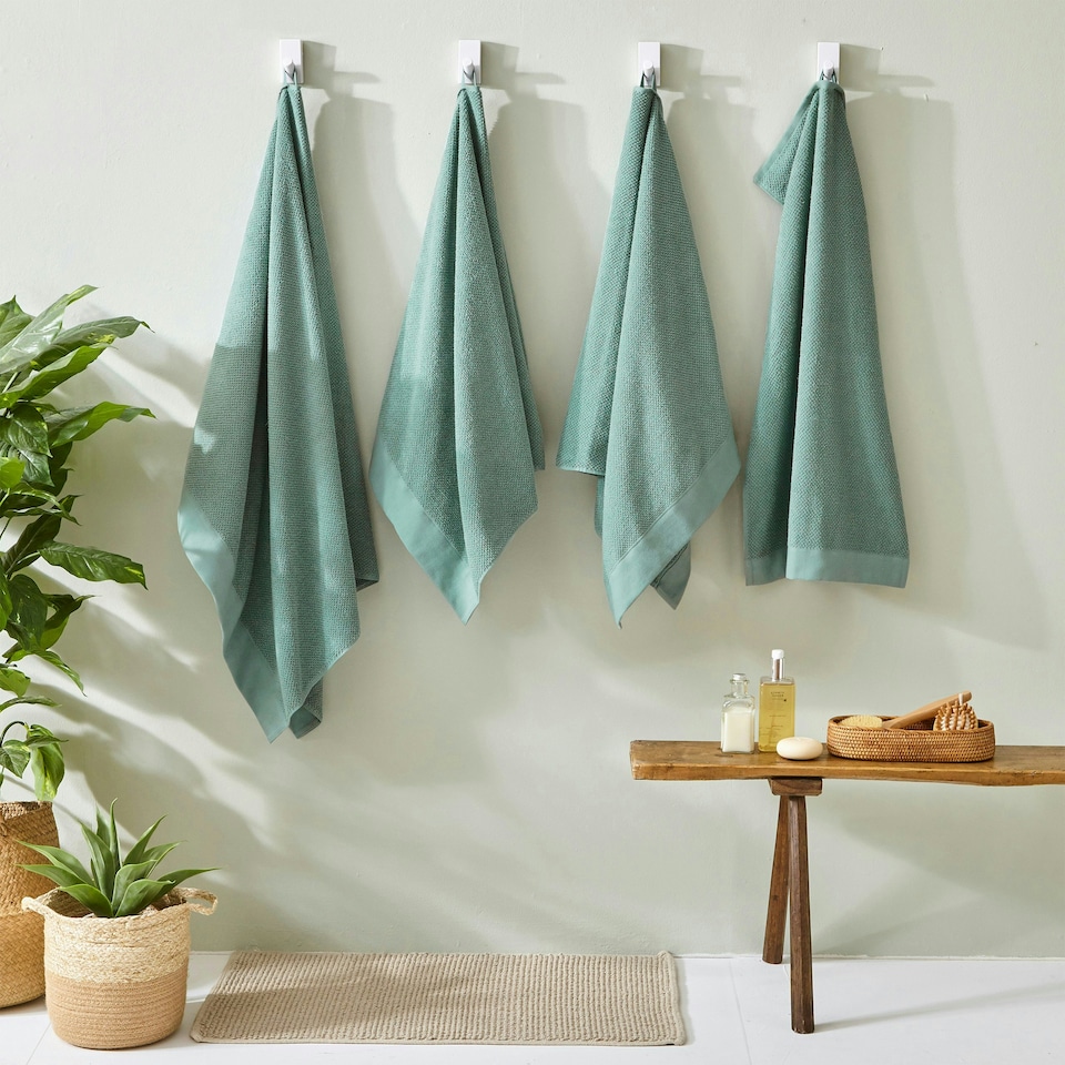 image 1 of furn. Textured Hand Towel Smoke Green
