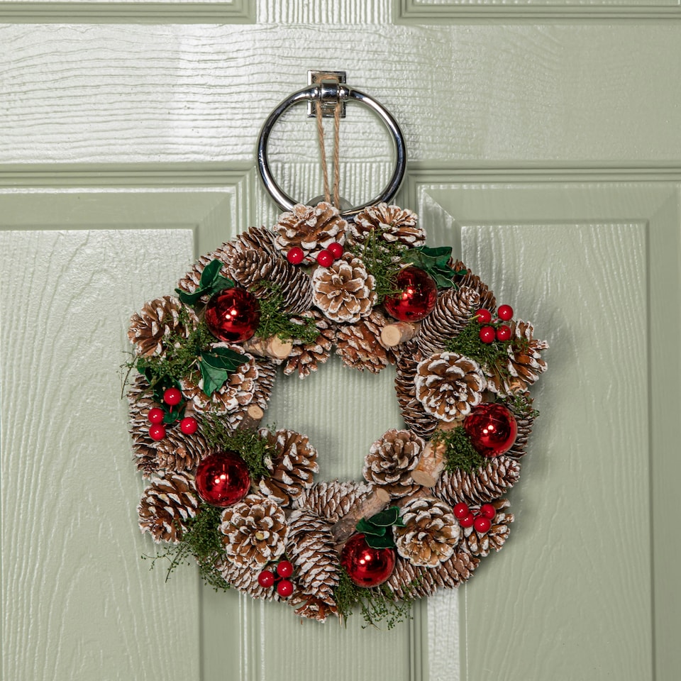 image 1 of 30cm Hanging Christmas YuleFest Wreath with Red Baubles & Snow Tipped Pine Cones