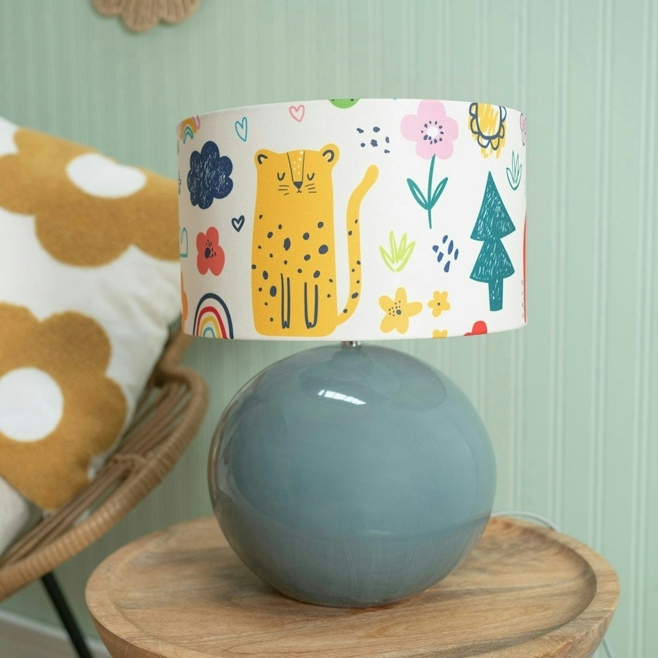 image 1 of ValueLights Bosco Eucalyptus Teal Globe Ceramic Table Lamp with Cartoon Doodle Lamp Shade and LED Bulb