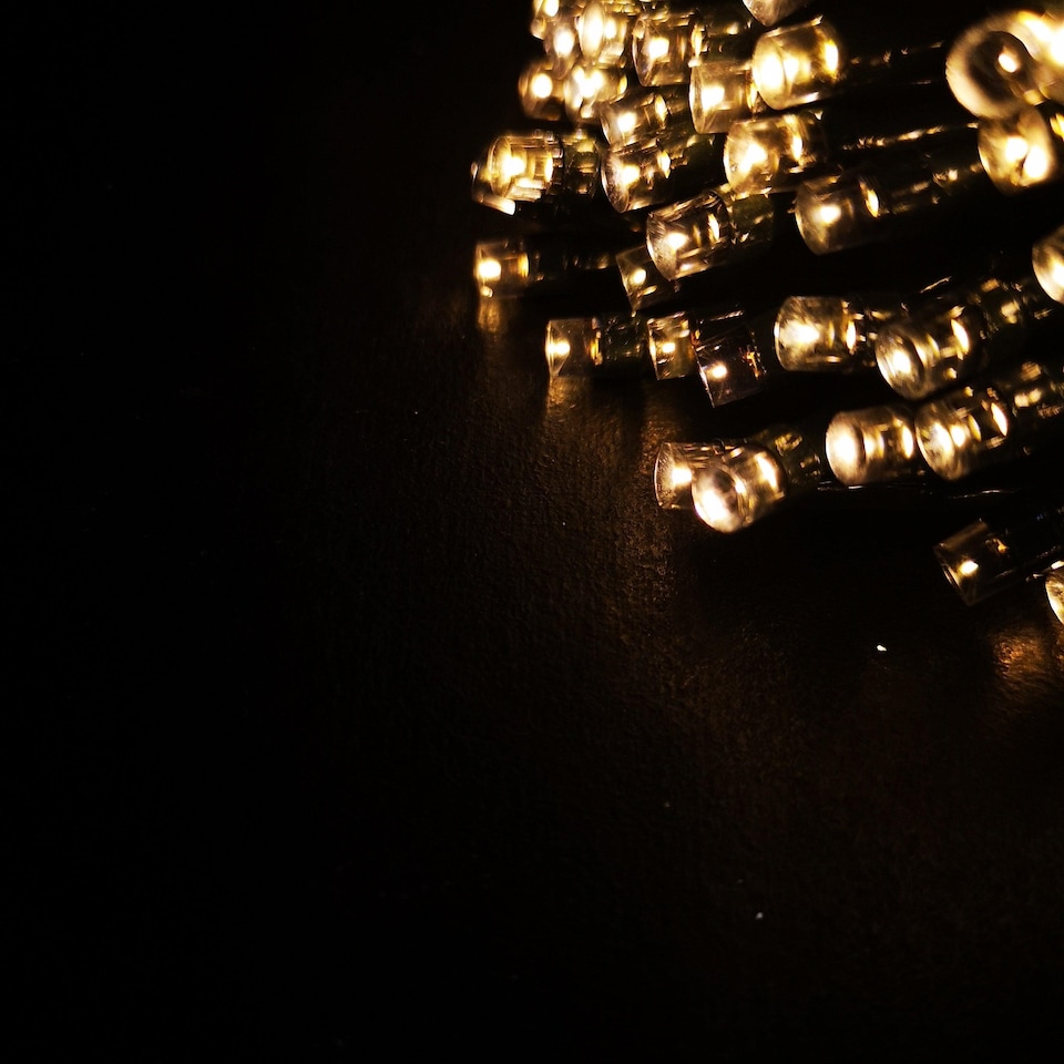 image 1 of 100 LED 10m Premier Christmas Outdoor Multi Function Battery Lights with Timer & Clear Cable in Warm White