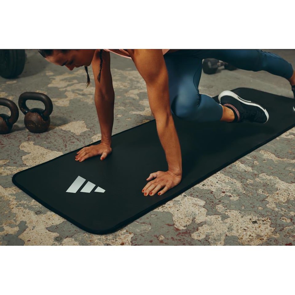image 1 of Adidas 10mm NBR Training Mat — Cushioned, Non-slip Yoga & Exercise Mat with Carry Strap. | Black | Black | 183cm (L) x 61cm (W) x 1cm (H)
