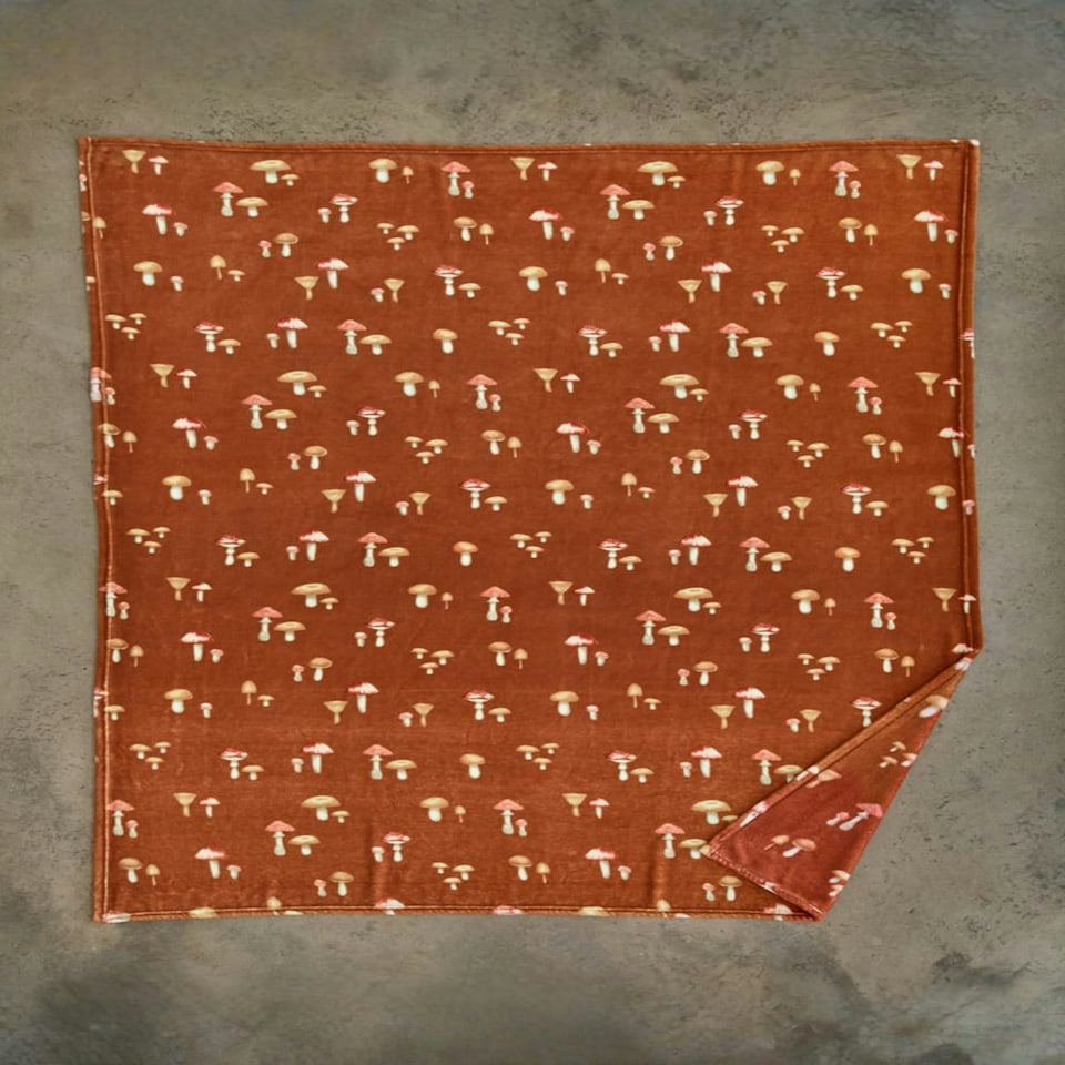 image 1 of Toadstool Scatter Throw – Rust Coloured Blanket Decorated with Mushroom Motifs 140x180cm Multi | Rust