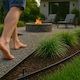 image 7 of Harbour Housewares Flexible Plastic Lawn Edging with 200 Pegs & Mallet - 50m x 4cm - Black | Black | 5
