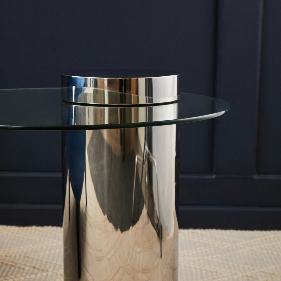 image 1 of Interiors by Premier Clear Glass Side Table with Silver Base, Round Tempered Glass C‑Shape Accent Table, Steel Silver‑Finish Silver