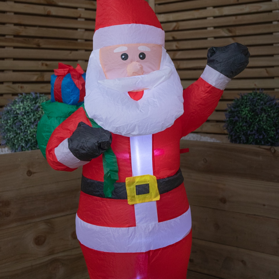 image 1 of 130cm (4ft) Inflatable LED Outdoor Christmas Standing Santa with Gift in Sack