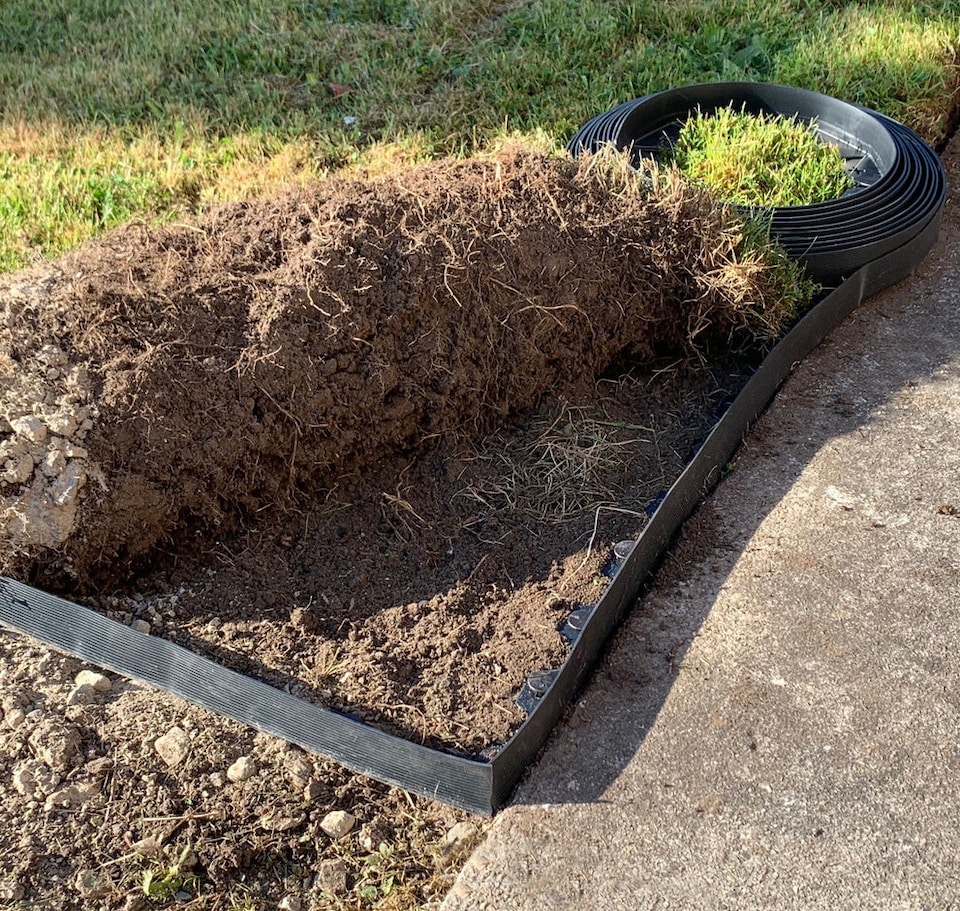 image 1 of Flexible Black Plastic Garden Lawn Edging with 40 Pegs (10m) - 2 Rolls