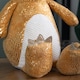 image 8 of 60cm Tall Gold Plush Zilla Dino Sitting Christmas Decoration with Santa Hat
