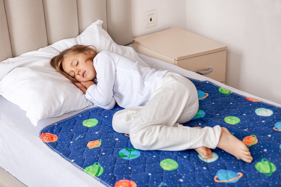 image 1 of Lynmark Toddler Potty Training Bed Pads, Absorbs Up to 1200ml, 90x85cm | Blue | Astronaut | 1