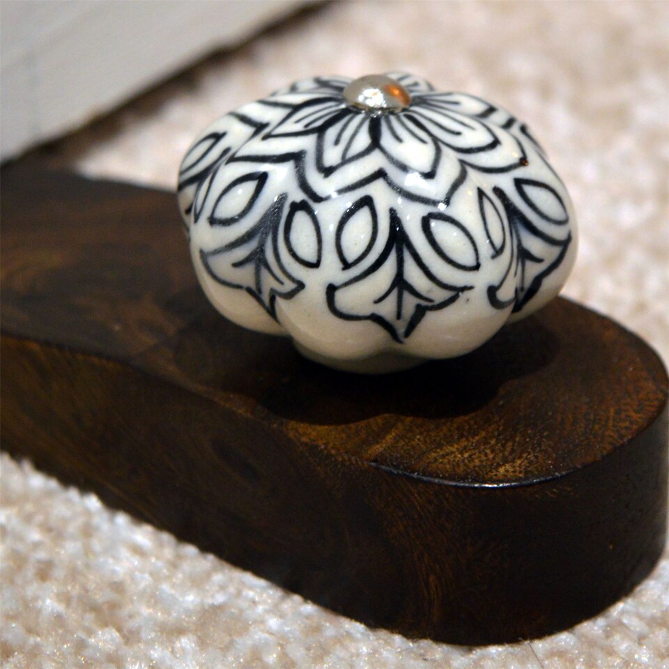 image 1 of Nicola Spring Wooden Door Stop - Black Flower